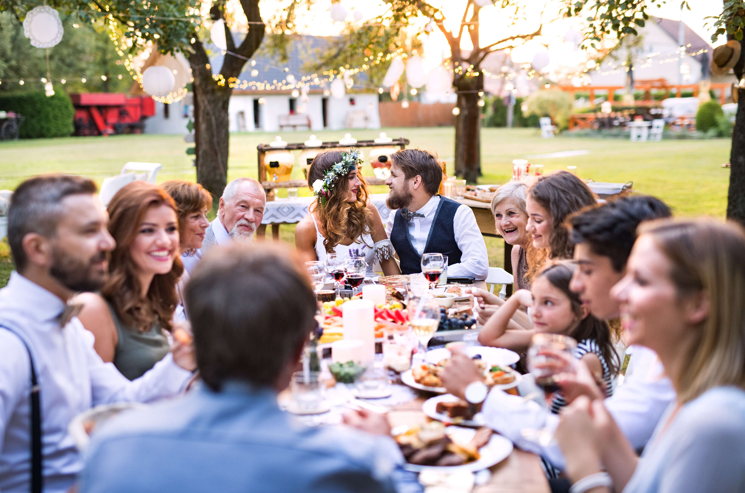 Table of people eating dinner at backyard wedding.jpg