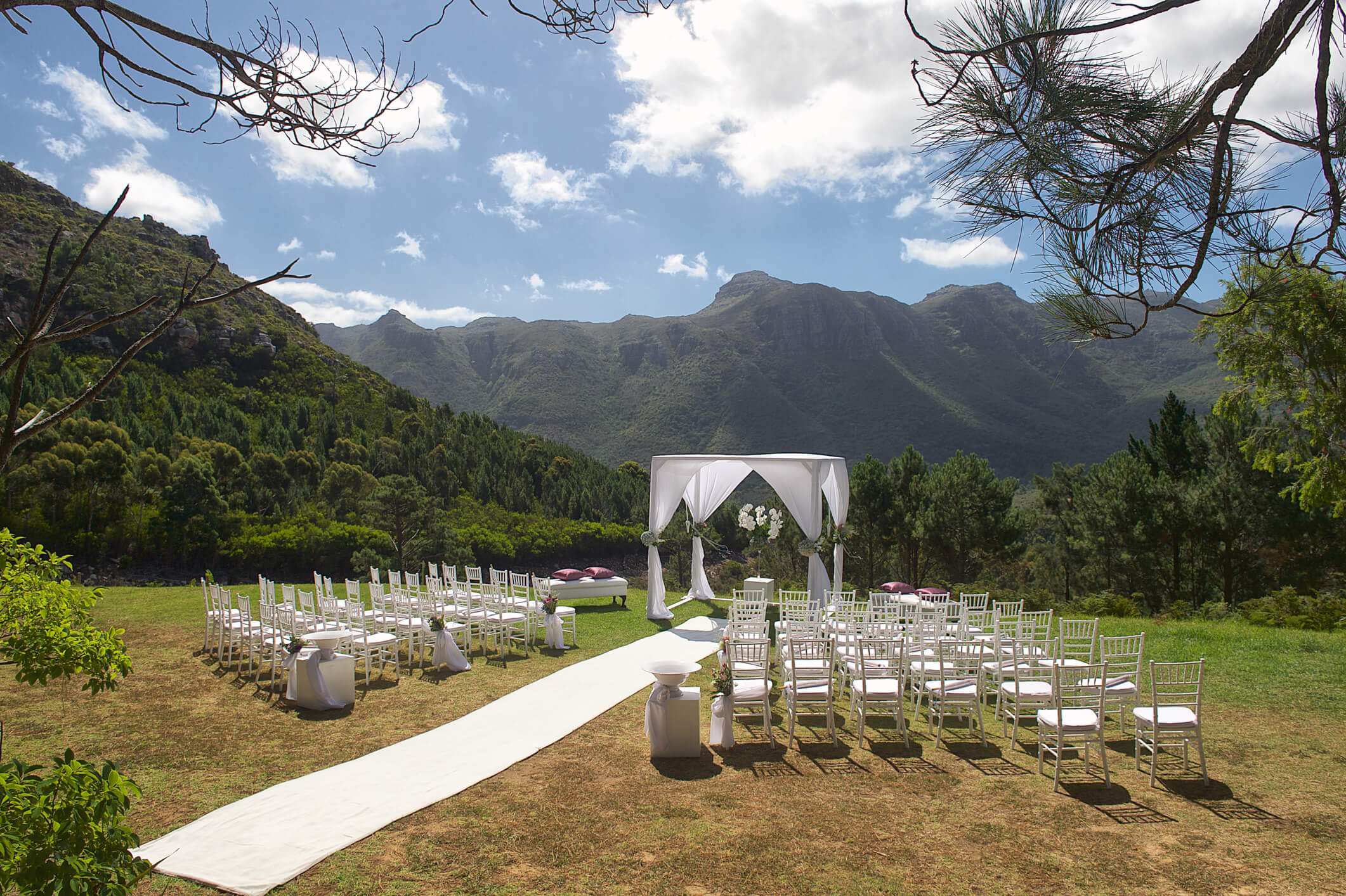 wedding ceremony seating and aisle with mountains in backdrop