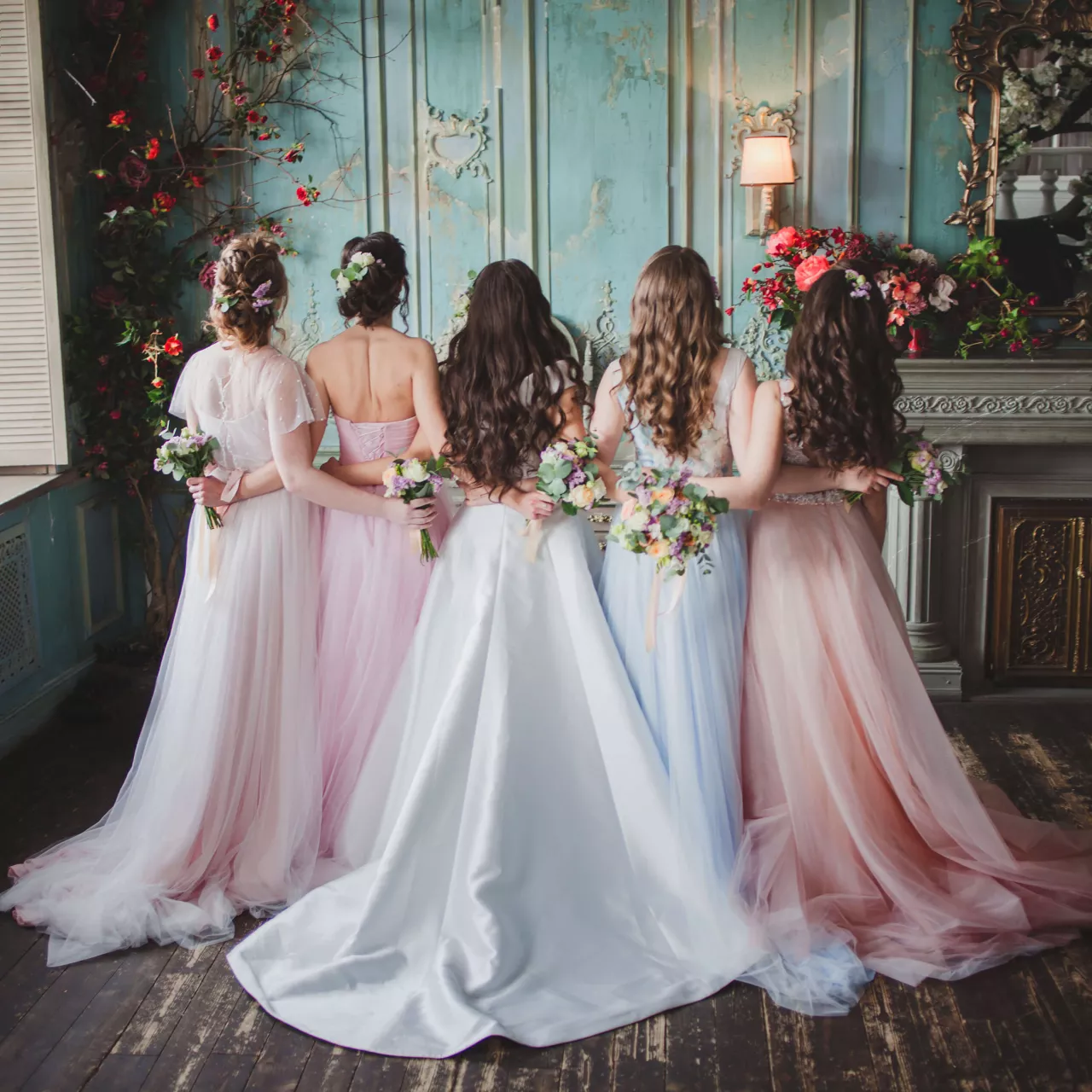 bride and her bridesmaids relax while getting ready