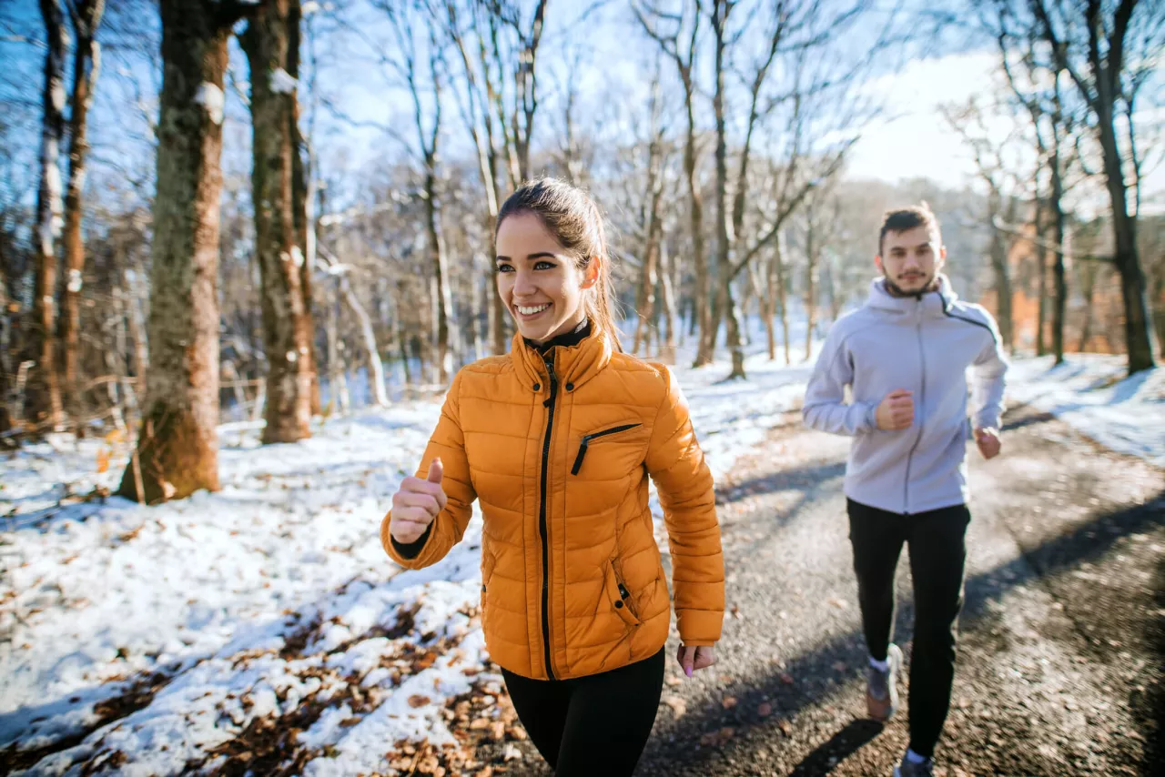 couple running outside in winter