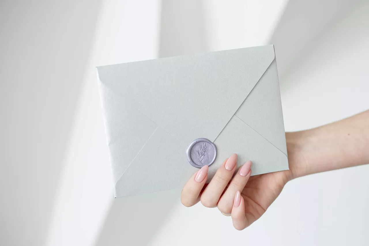Wedding invitation in sealed envelope