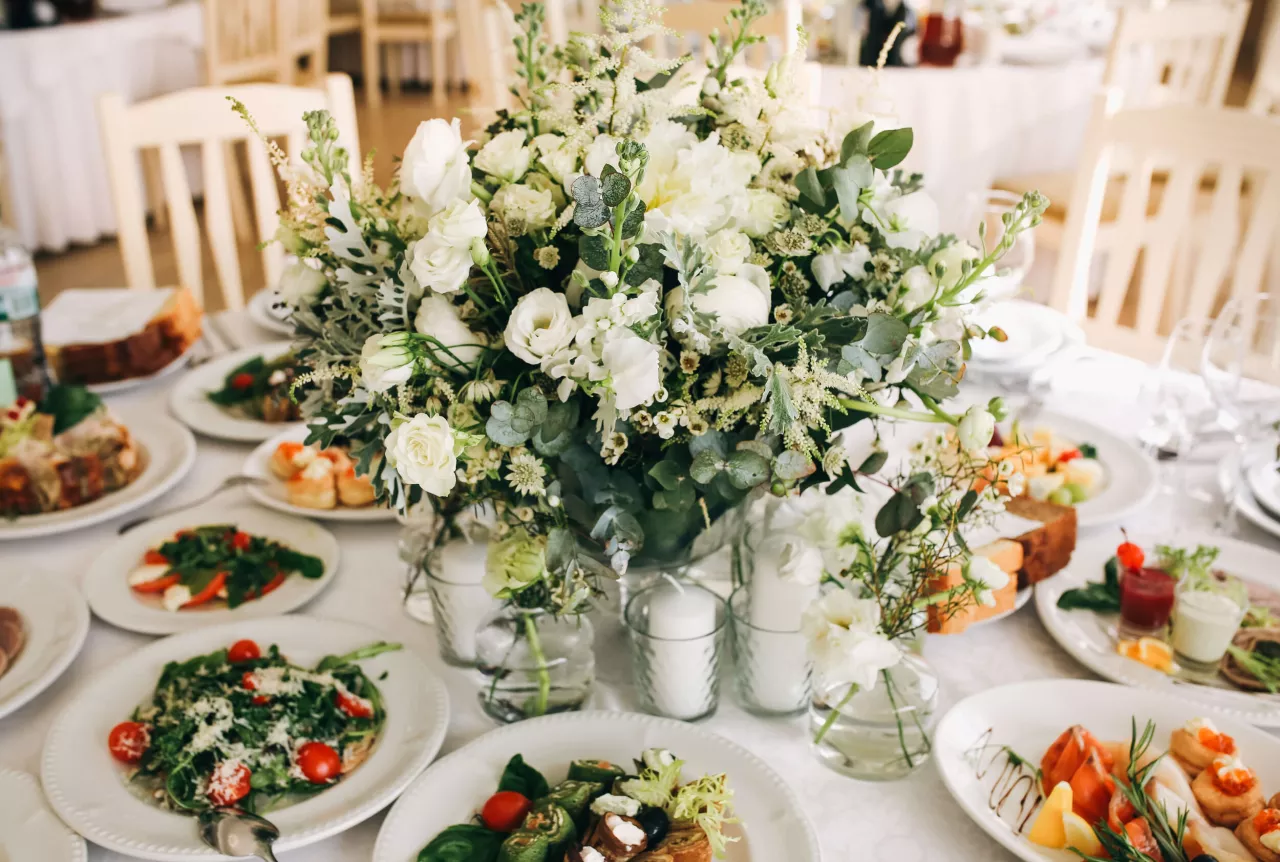 Wedding table with food and flower centerpiece