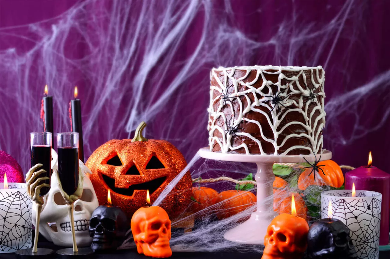 Halloween wedding decorations and cake on table