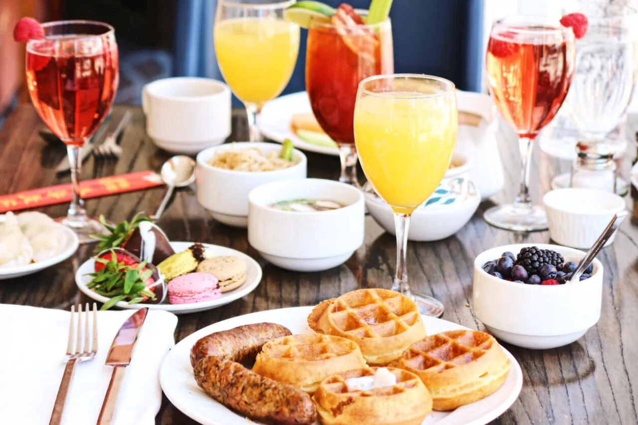 waffles sausage mimosas on table for wedding brunch