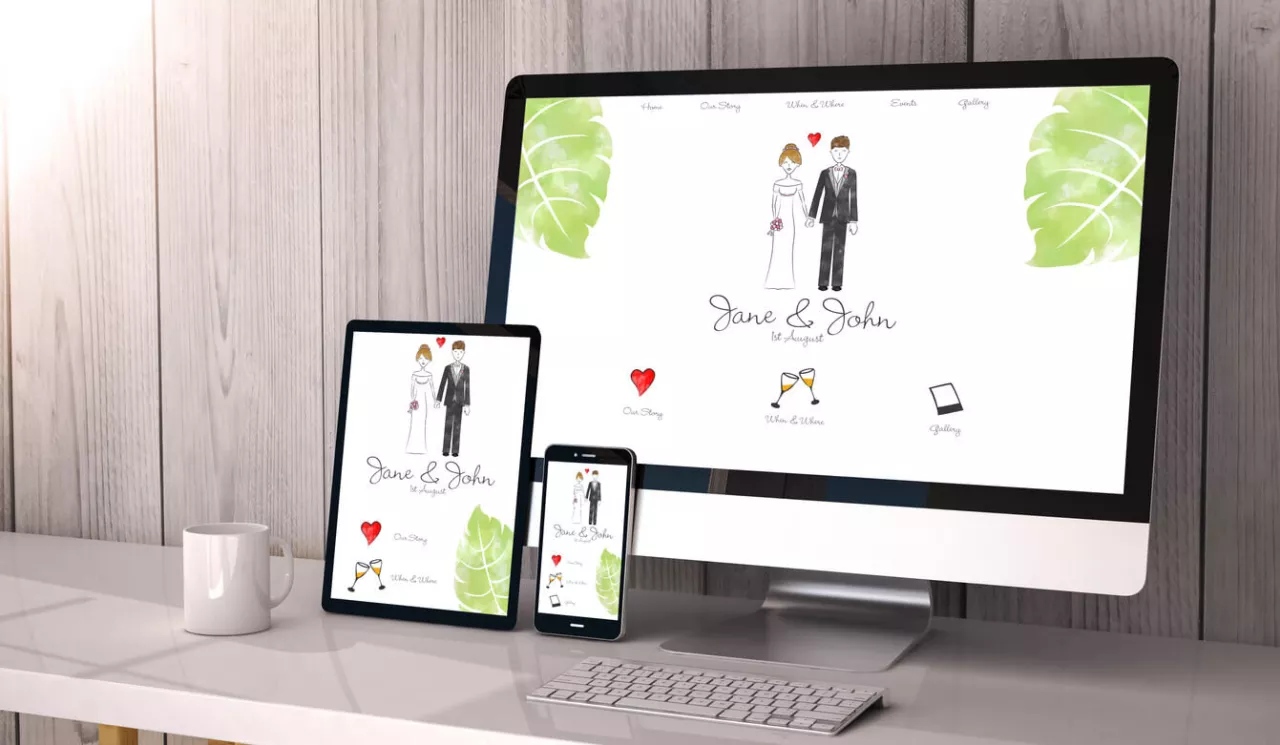 computer tablet and phone displaying wedding website