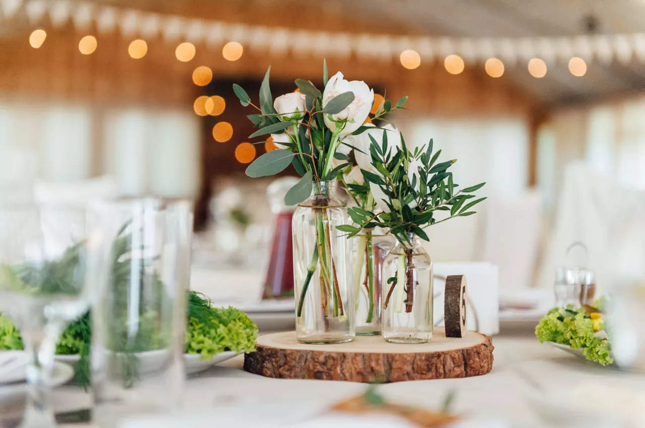 DIY wedding table decorations with wood and greenery