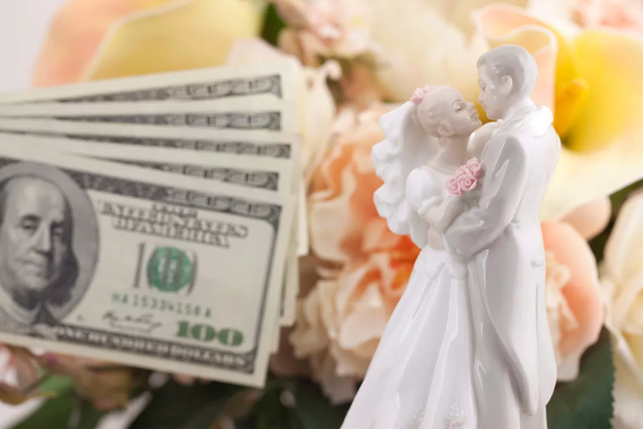 bride and groom cake topper with money saved