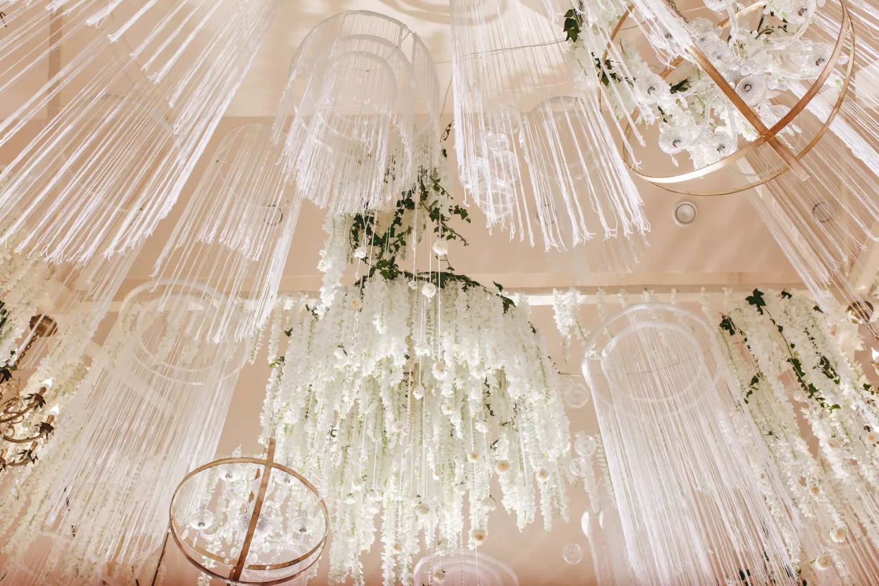 white flowers hanging for wedding ceiling decor